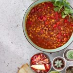red and green chili peppers in white ceramic bowl